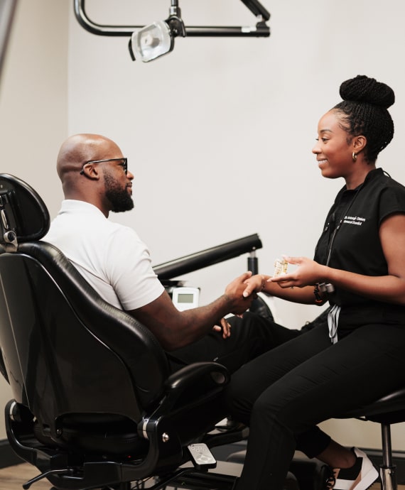 A photo of doctor and patient looking to each other