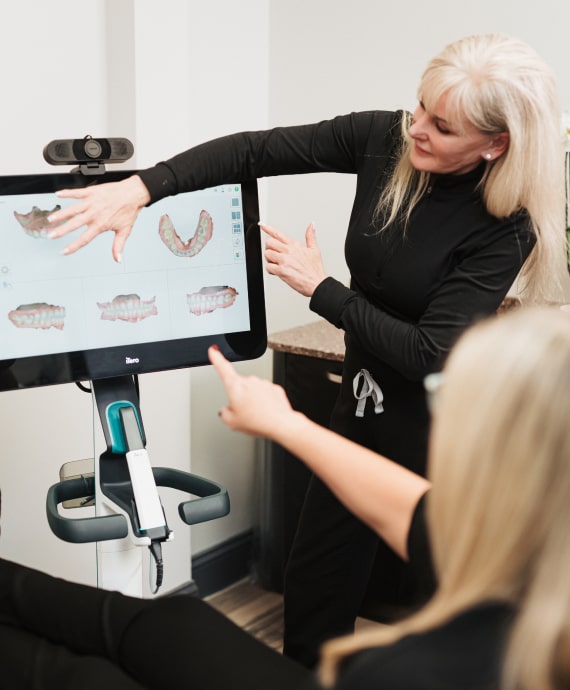 A photo of doctor and patient talking about teeth