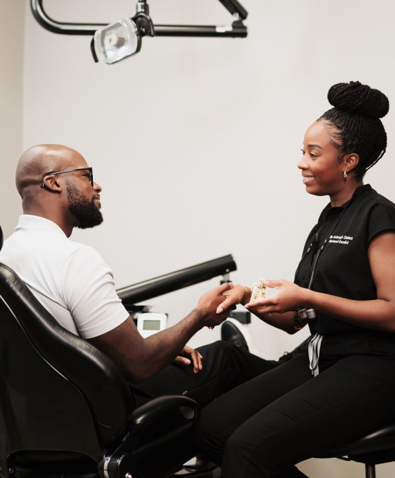A photo of our patient and doctor smiling to each other