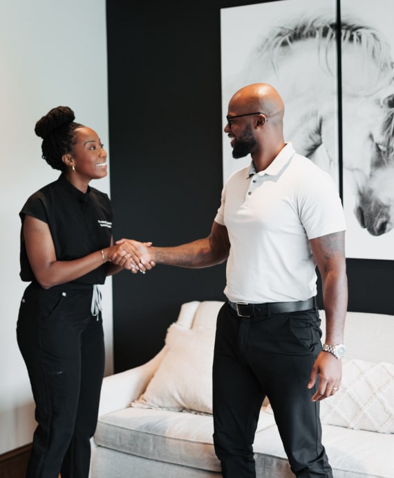 A photo of our patient and team member shaiking hands together