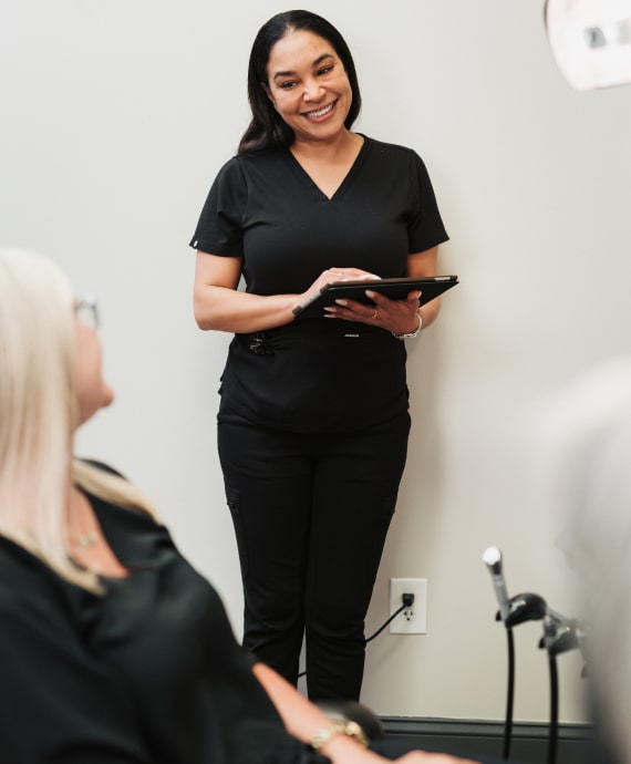 A photo of our patient and team member smiling to each other