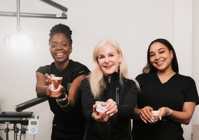 A photo of our team smiling together