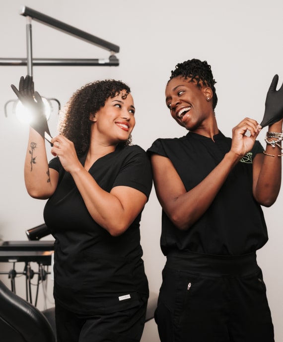 A photo of our team members smiling together