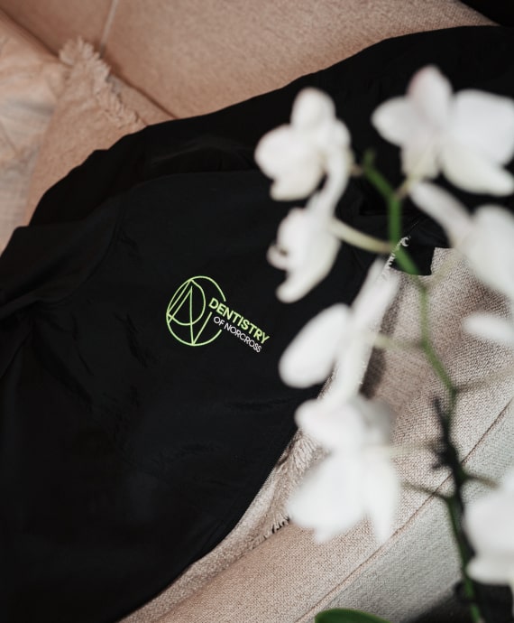 A photo of the logo our dentistry and flower