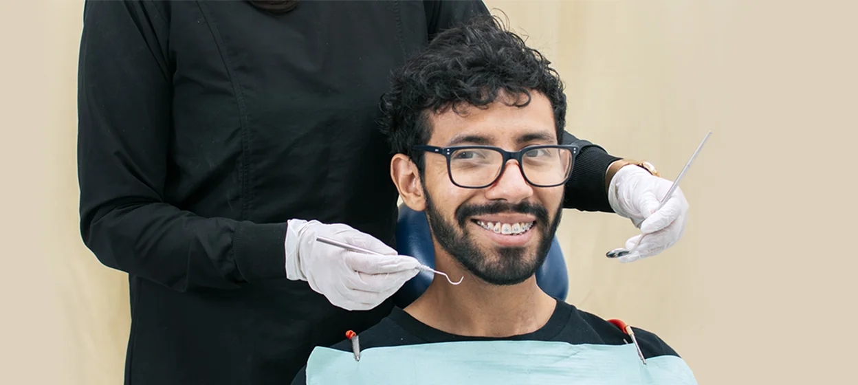girl touching her healthy teeth