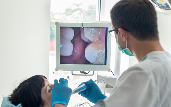 Dentist taking a close up photo of a patients teeth