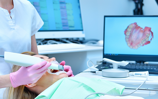 Dentist capturing digital impressions of a patients teeth