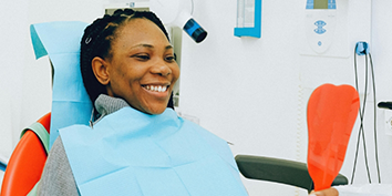 Woman grinning in the dental chair