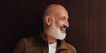 Smiling bald man with a gray beard