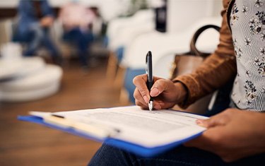 Patient filling out form in lobby