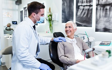 Patient smiling at dentist during routine visit