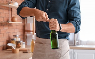 Man uses bottle opener