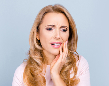 Why do my teeth feel loose and hurt? 